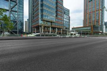 Fototapeta na wymiar empty road and modern office buildings.