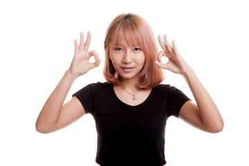 Asian woman show double OK hand sign  and smile.