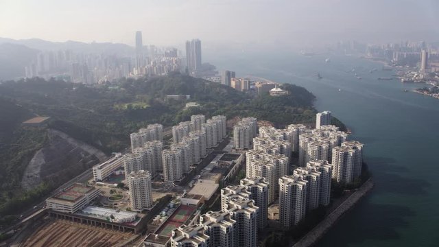 Hong Kong Aerial v213 Flying low over Shai Wan area panning with cityscape views