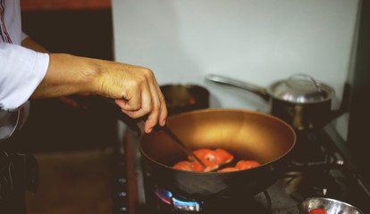 Cook with a pan, The chef is grilling salmon on the pan