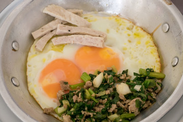 The close up of Thai delicious panned eggs on small aluminum pan.