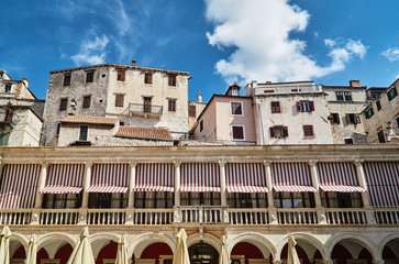 Renaissance town hall and stone houses in the city of Sibenik in Croatia.