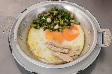 The close up of Thai delicious panned eggs on small aluminum pan.