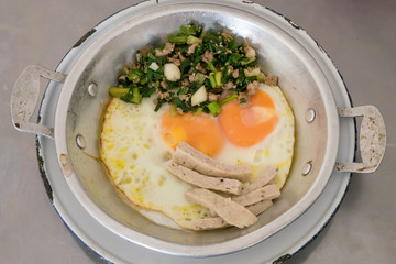 The close up of Thai delicious panned eggs on small aluminum pan.