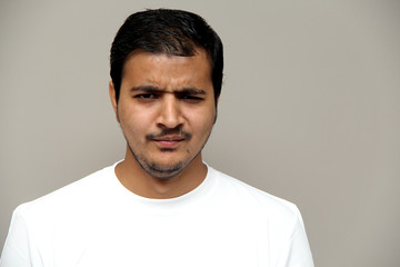 Fototapeta premium expressions of young amazed man isolated on gray background