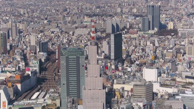 Japan Tokyo Aerial v93 Flying around NTT Docomo clock tower with Shinjuku cityscape views 2/17