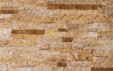 The texture of the stone of the facade . Lining material