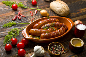 Fried sausage on a wooden background