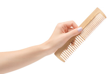 Female hand wooden comb