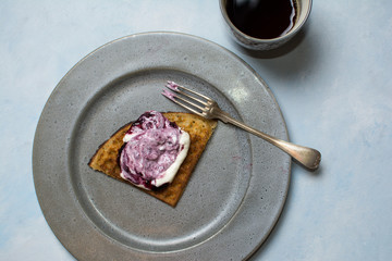 Swedish waffles with whipped cream and blueberry jam