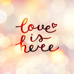 love is here lettering, vector handwritten text on lights