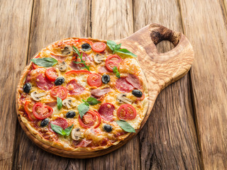 Pizza with fresh tomatoes and herbs. Top view.