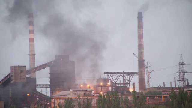 photograph of a smoky metallurgical plant