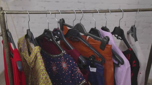 Women's clothing, fashion design, girl choosing clothes in a store