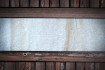 white fabric cloth texture on wooden background