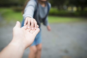 Parent and child playing in the park