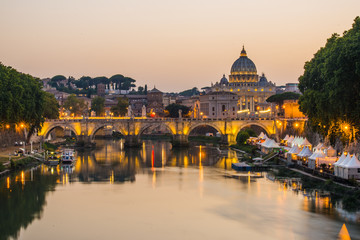 Fototapeta na wymiar image of River Tiber, including: Ponte Sant Angelo and St. Peter's Basilica in the background. Rome - Italy.