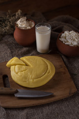 Organic milk cottage cheese and sour cream in vintage dish on rustic background