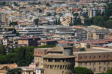 Fototapeta na wymiar Background with town roofs, cityscape. Buildings of the city - urban background and town landscape. Houses and rooftops of a big city as texture. ROME