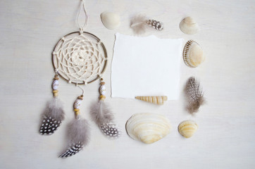Seashells frame on wooden background with place for text.