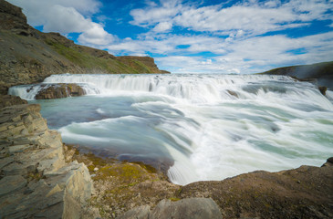 Fototapeta na wymiar GULLFOSS, The most famoust Icelandic waterfall, The Golden Falls of Gullfoss, Summer time in Iceland