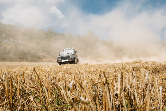 Car driving in dust