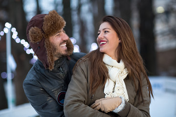 Fototapeta premium Young couple smiling and enjoy at wintertime moments