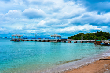 Beautiful sea with sky full of clouds and landscape with harbour