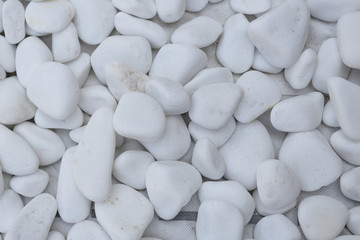 Close up of a bunch of white polished stones