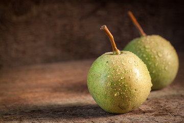 Two green pears in evening light