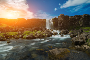 Fototapeta na wymiar Thingvellir National Park rift valley, Waterfall into The Mid Atlantic Rift, Pingvellir, Iceland
