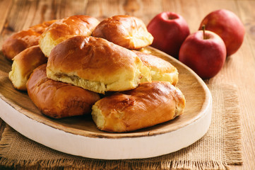Naklejka na ściany i meble Homemade bread buns with apple filling.