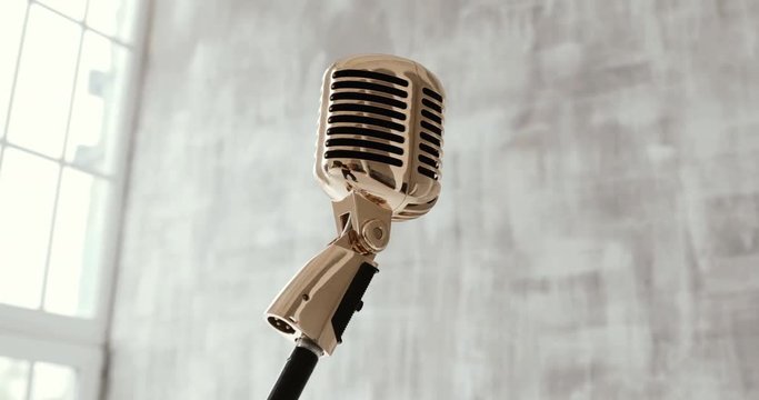 Vintage classic microphone on stage on white background. close up