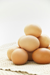 Fresh eggs on white background with copyspace. Easter photo concept