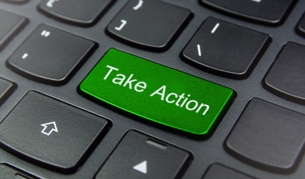 Close-up the Take Action button on the keyboard and have Green color button isolate black keyboard