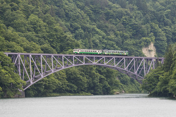 The local train Tadami line and Tadami river. This train services in East Japan railway company's Tadami line.