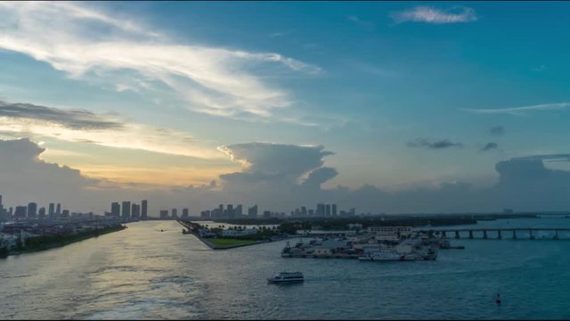 Time-Lapse of Sailing from the port of Miami at the sunset by the cruise ship. Florida