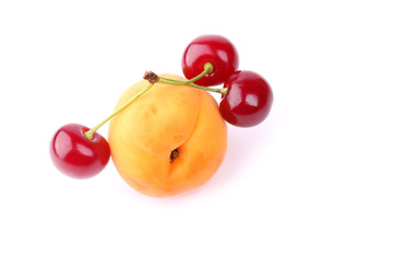 Cherry and apricot isolated on white background