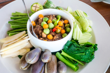 Shrimp paste sauce with crispy fried fish and sweet pork and boiled vegetables (Naam Prik Long Rau)