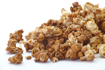 Close - up Caramel chocolate popcorn on white background