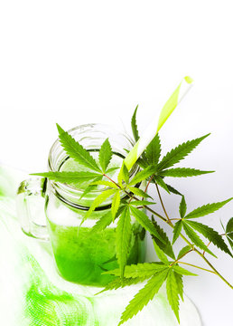 Green marijuana juice on white