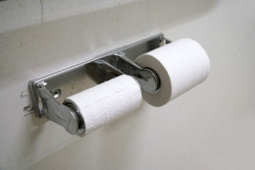 Close up on toilet paper roll in the bathroom