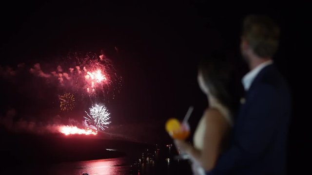 4k video amazing fireworks over island and sea with romantic couple