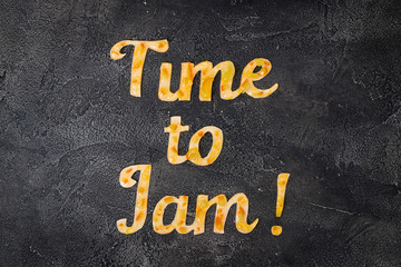 Fototapeta premium Food typography Time to Jam on dark background. Orange jam lettering