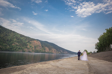 Fototapeta premium the bride and groom are in the distance