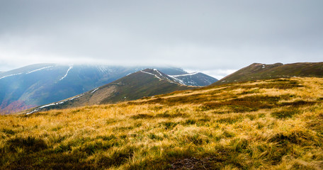 Autumn mountains in cloudly day