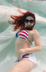 Woman in a swimsuit underwater.