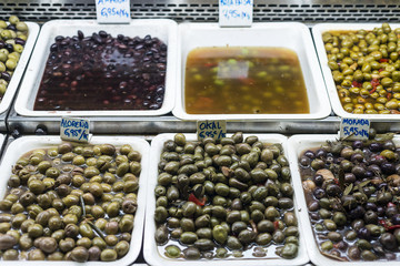 mixed olive snacks in market display trays barcelona spain