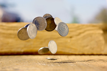 Indian coin on wooden texture ,