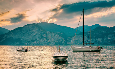 Boats moored at sunset on Lake Garda